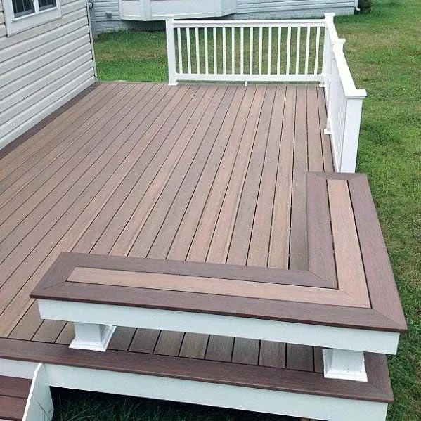 Multi-level composite deck with brown boards, white railing, and stepped design
